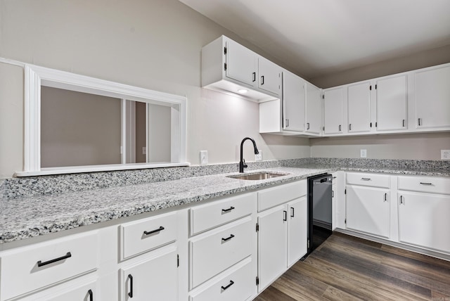 kitchen featuring sink, dark wood-type flooring, black dishwasher, light stone counters, and white cabinets