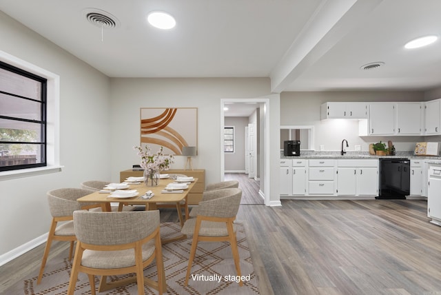 dining area with light hardwood / wood-style flooring