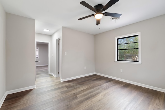 spare room featuring ceiling fan and wood-type flooring