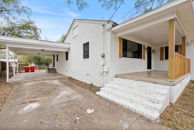 view of side of property featuring a carport