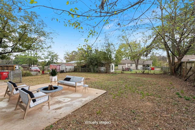 view of yard featuring a patio and a fire pit