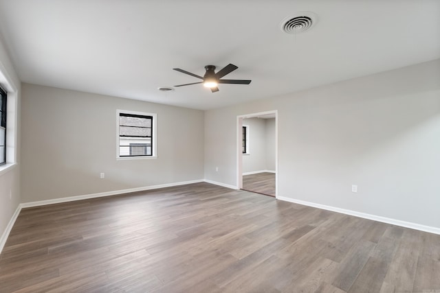 unfurnished room with wood-type flooring and ceiling fan