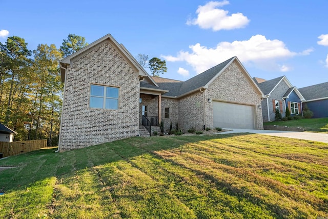 view of front facade with a front yard and a garage