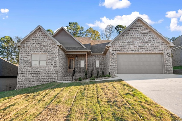 view of front of home featuring a garage and a front yard