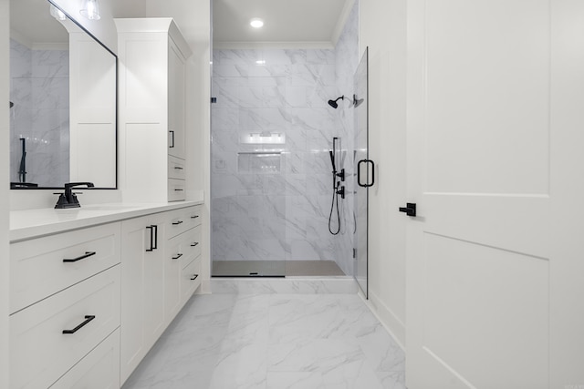 bathroom with walk in shower, vanity, and ornamental molding