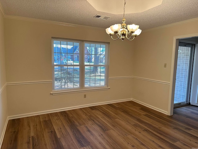 unfurnished dining area featuring a chandelier, dark wood-type flooring, a textured ceiling, and ornamental molding