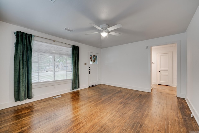 spare room featuring hardwood / wood-style floors and ceiling fan