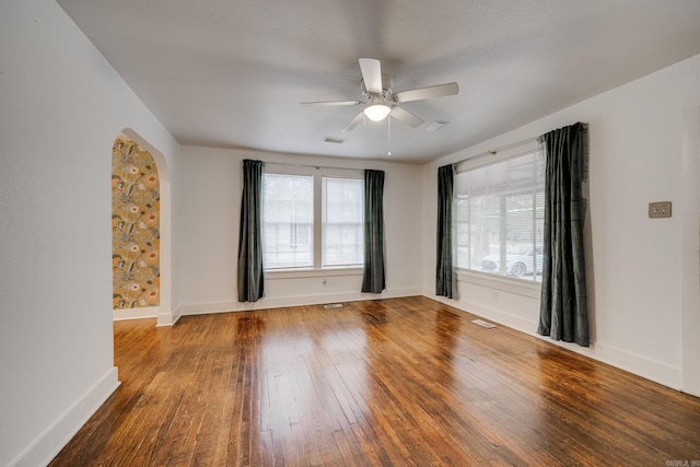 unfurnished room featuring hardwood / wood-style floors and ceiling fan