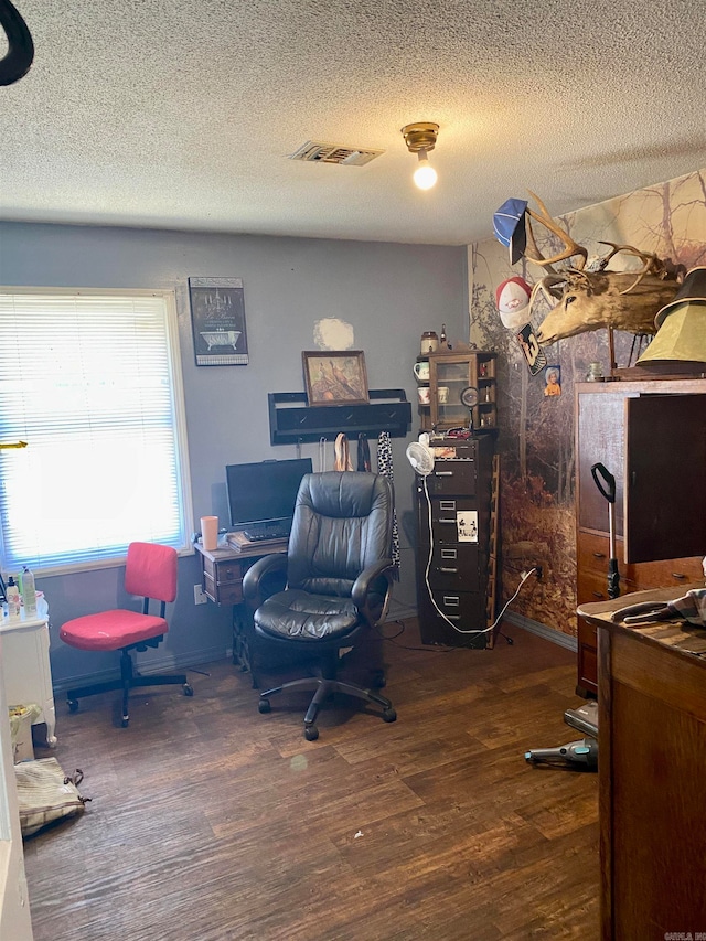 office space with dark hardwood / wood-style flooring and a textured ceiling