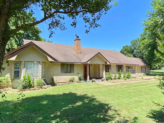 single story home with a front lawn