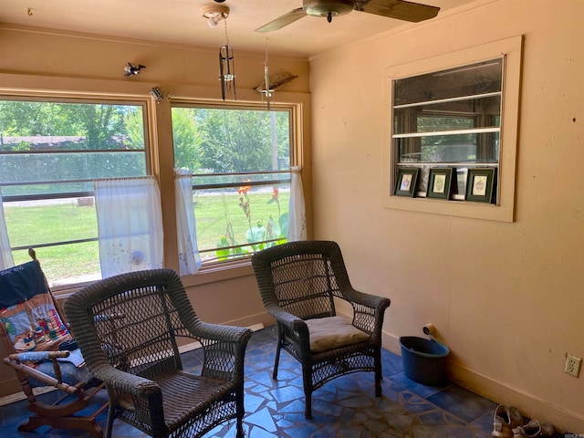 sitting room featuring plenty of natural light and ceiling fan