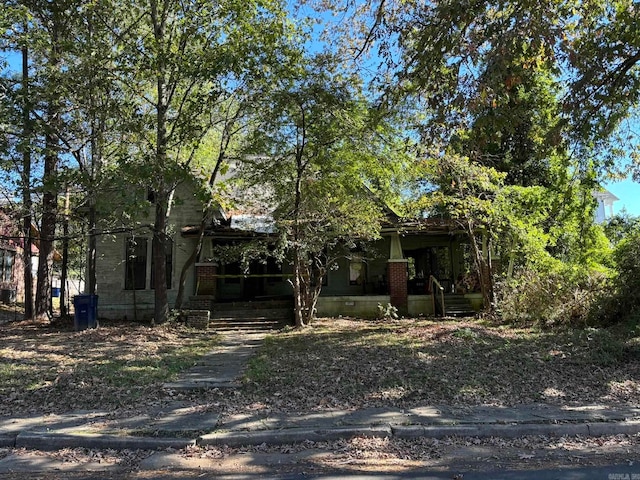 view of property hidden behind natural elements