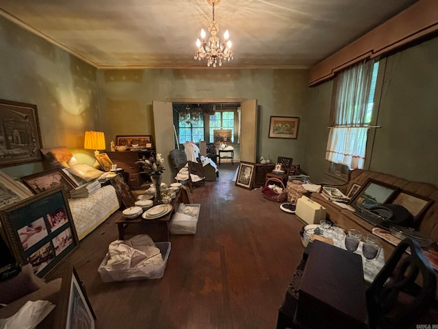 misc room with dark hardwood / wood-style flooring, crown molding, and a notable chandelier