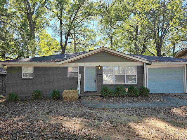 ranch-style home with a garage