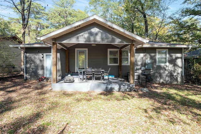 back of property with a patio