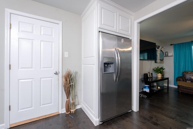 kitchen featuring white cabinets, stainless steel fridge, and dark hardwood / wood-style flooring