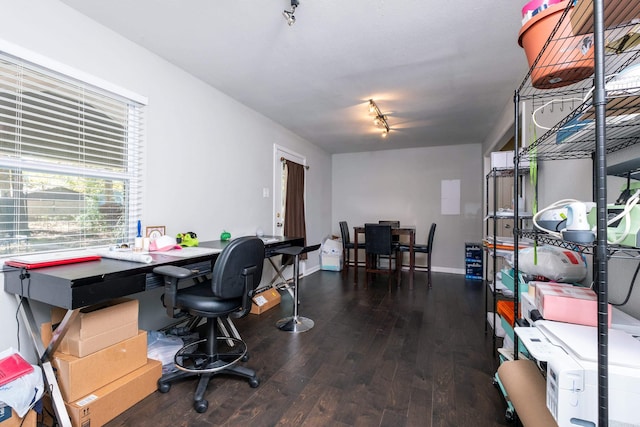 office with dark hardwood / wood-style flooring and track lighting