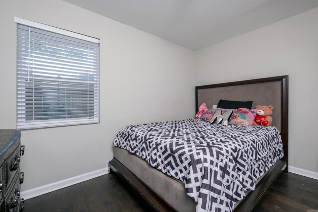 bedroom featuring dark hardwood / wood-style flooring