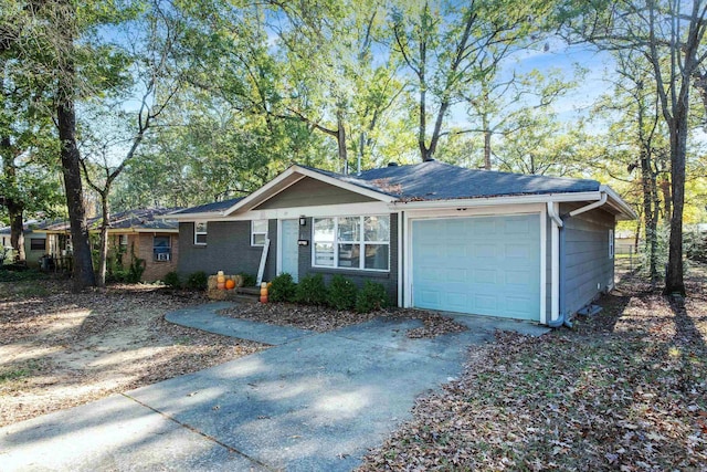 ranch-style house featuring a garage