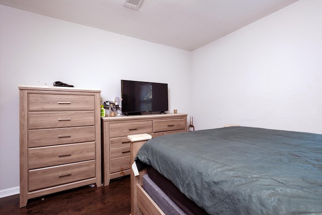 bedroom featuring dark wood-type flooring