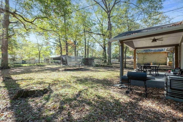 view of yard featuring ceiling fan