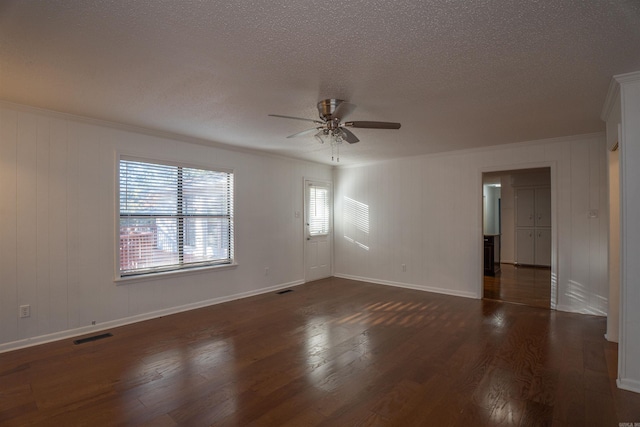 unfurnished room featuring dark hardwood / wood-style floors, ceiling fan, and a textured ceiling