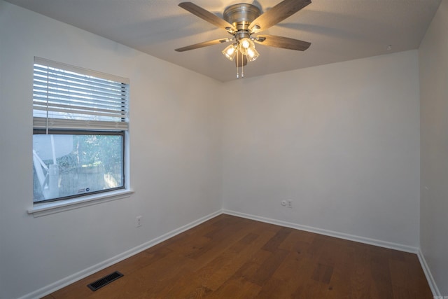 unfurnished room with ceiling fan and dark hardwood / wood-style floors