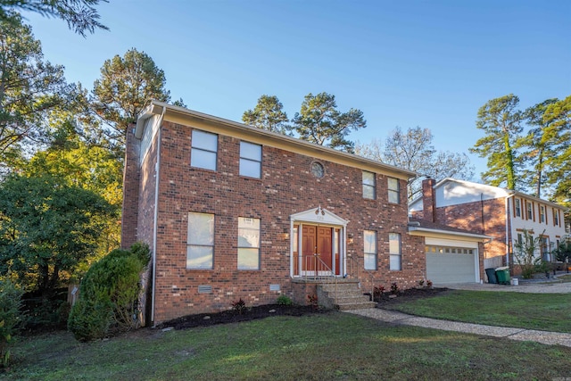 view of front facade featuring a garage and a front lawn