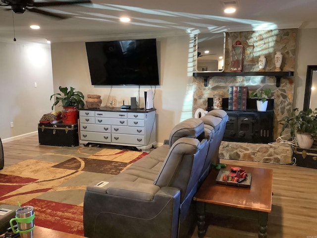 living room with ceiling fan, ornamental molding, and hardwood / wood-style flooring