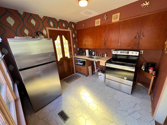 kitchen featuring a healthy amount of sunlight and appliances with stainless steel finishes