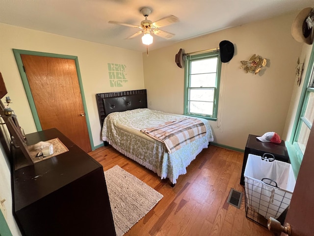 bedroom featuring hardwood / wood-style flooring and ceiling fan