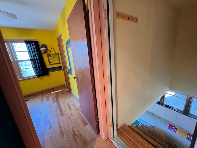 hallway with light wood-type flooring