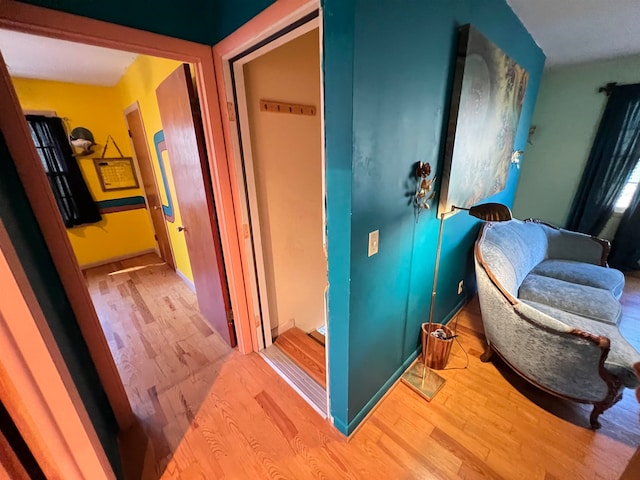 corridor featuring light hardwood / wood-style flooring