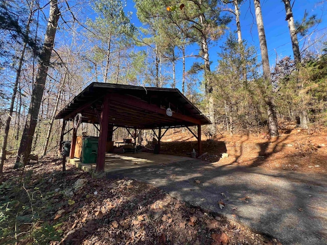 view of parking / parking lot with a carport