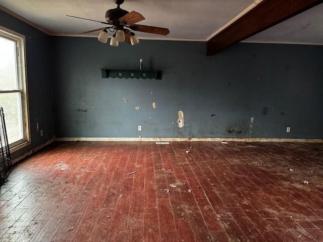 spare room with crown molding, ceiling fan, and wood-type flooring