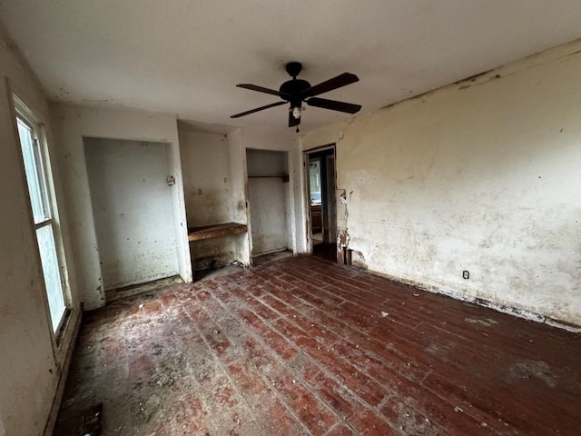 interior space with ceiling fan and a healthy amount of sunlight