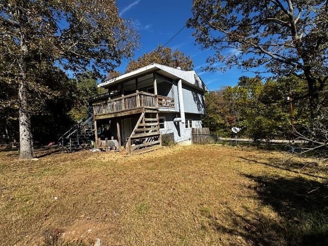 back of house with a wooden deck