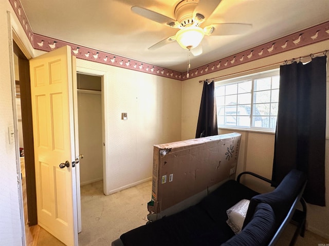 carpeted bedroom with a closet and ceiling fan