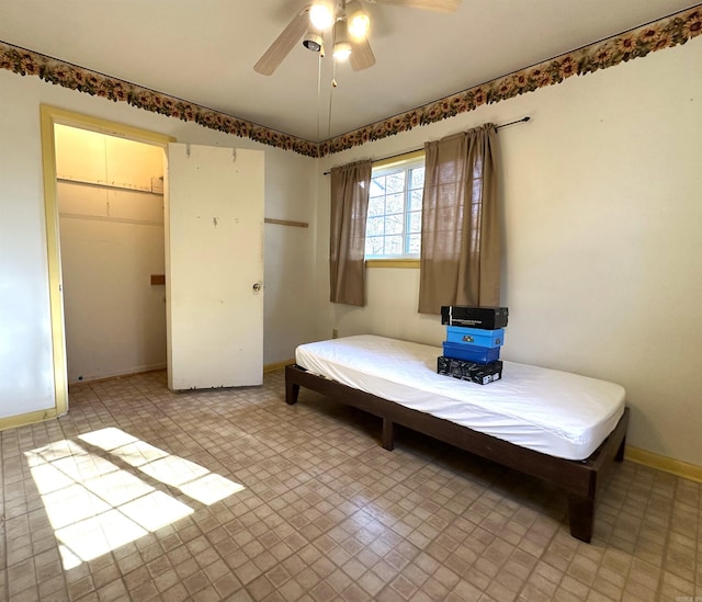 bedroom featuring ceiling fan and a closet