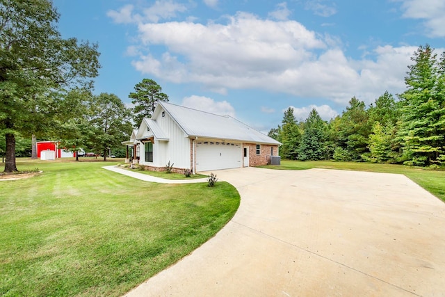 view of side of home featuring a garage and a yard