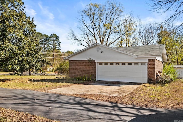 view of property exterior with a garage