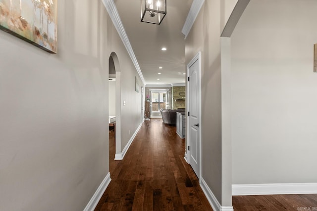 hall featuring dark hardwood / wood-style flooring and crown molding