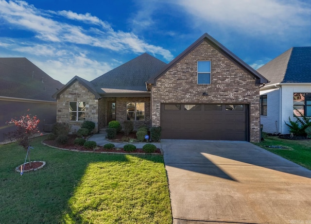 view of front of house with a garage and a front yard