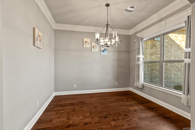 unfurnished dining area featuring a chandelier, crown molding, and dark wood-type flooring