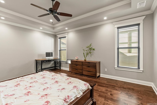 bedroom with a raised ceiling, ceiling fan, dark hardwood / wood-style flooring, and ornamental molding