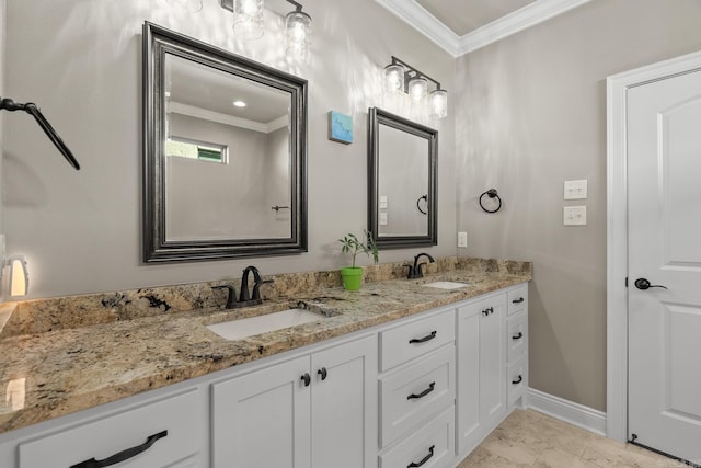 bathroom with crown molding and vanity