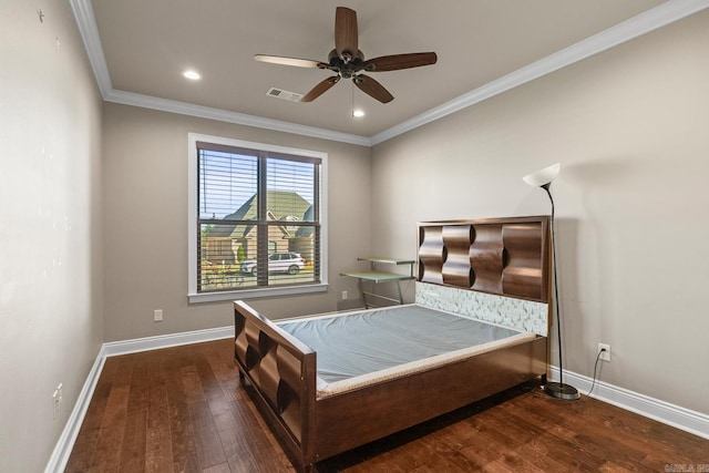 bedroom with ornamental molding, ceiling fan, and dark wood-type flooring