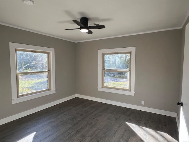 spare room with dark hardwood / wood-style flooring, ceiling fan, and crown molding