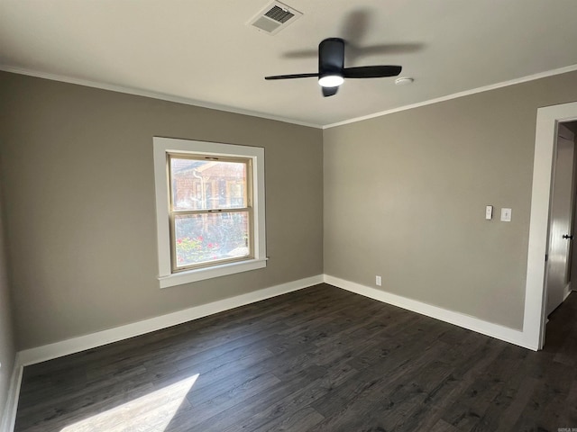 spare room with crown molding, ceiling fan, and dark wood-type flooring