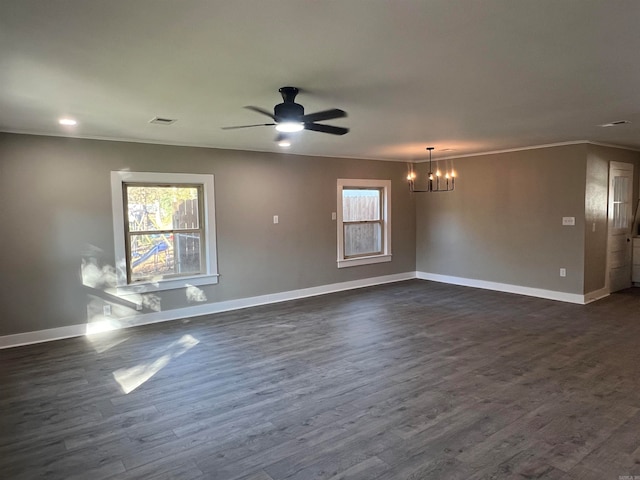 unfurnished room with ceiling fan with notable chandelier, dark hardwood / wood-style floors, and ornamental molding